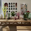 Flowers and Plants Arranged on Long Wooden Table in Bright Indoor Space with Decorative Vases