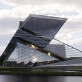Modern Sales Office Building With Angled Roof COHI Signage Glass Curtain Wall And Landscaped Lawn