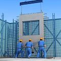 Construction Site Workers in Yellow Hard Hats Installing Concrete Panel With Blue Safety Netting