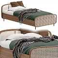 Modern Single Bed Featuring Wooden Frame Rattan Panels Green Sheets And Gray Blanket
