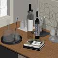 Wine Bottles and Glasses on Wooden Table with Trays Books and Decorative Artwork