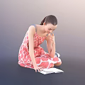 Woman Sitting on Floor Reading Book in Pink Floral Dress with Sneakers and Ponytail