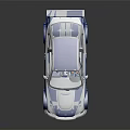 Blue and white race car model with sporty design rear spoiler on black reflective surface