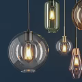 Modern Glass Pendant Lights In Various Shapes With Golden Metal Frames And Illuminated Bulbs