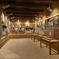 Vintage Exhibition Hall Interior with Black and White Photos Wooden Display Cases and Spotlights