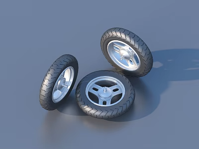 Three Motorcycle Tires With Silver Spoke Rims And Tread Pattern On Gray Surface 3d model