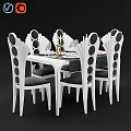 Elegant White Dining Table And Chairs With Black Circular Patterns Wine Glasses And Tableware