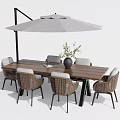 Outdoor Wooden Table And Wicker Chair Set With Umbrella Vase And Green Plant