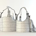 Chic Leather Storage Baskets with Black Handles Holding Firewood and Blanket Tassels