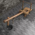 Wooden Garden Ornament With Seesaw Like Structure Against Brick Wall And Stone Pavement