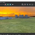 Beautiful Sunset Landscape With Vast Green Lawn Scattered Trees And Distant Modern Urban Buildings
