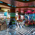 Modern Retail Store Interior With Colorful Ceiling Display Shelves And Merchandise