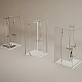Three Modern Transparent Glass Shower Enclosures With Stylish Shower Head Units