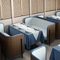 Cozy Restaurant Interior With Blue And White Tablecloths Wooden Partitions Pendant Lights And Booth Seats