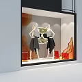 Fashion Window Display With Mannequins In Black Skirts And Cat Shaped Decor