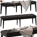 Stylish Tufted Sofa Bench With Dark Gray Upholstery And Black Slender Legs And Light Blanket