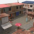 Traditional Commercial Street With Rusted Red Blue Roofs Open Courtyard And Small Stalls