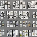 Various Size Photo Frames With Different Designs And Decorative Art Arranged On Gray Background