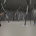 Tilted Silver Metal Poles In Gray Room With People Taking Photos And Standing