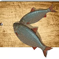 Two Fresh Fish With Red Fins And Silver Scales On Wooden Cutting Board