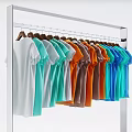 T shirts In Various Colors Hanging Neatly On Metal Clothing Rack