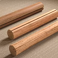 Three Natural Stone Wood Cylinders Placed On Woven Carpet For Home Decor