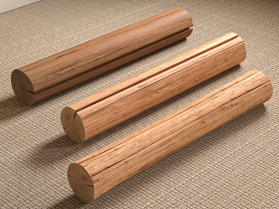 Three Natural Stone Wood Cylinders Placed On Woven Carpet For Home Decor 3d model