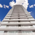 Modern High Rise Residential Buildings With Glass Curtain Walls And Landscaped Ground