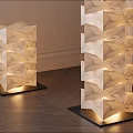 Three Stacked Cube Floor Lamps In Living Room Corner With Potted Plant And Natural Light