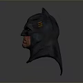 Man Wearing Detailed Batman Mask with Fierce Expression and Dark Design