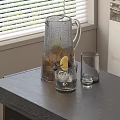 Clear Glass with Lemon Slice Ice and Empty Glass on Gray Table Near Window Blinds