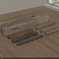 Wooden Pieces in Different Colors and Shapes on Wood Floor Near Window with Green Plant