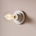 Wall Mounted Transparent Bulb With Visible Filament White Base On Light Wall Dark Vertical Stripe