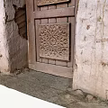 Traditional Building Exterior Wall with Intricate Carved Wooden Door and Rough Texture