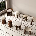 Various Designed Stools Arranged On Striped Rug Near Window With Green Plants