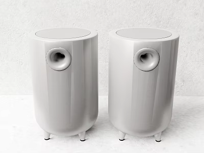 Two White Cylindrical Speakers With Round Speaker Holes And Small Feet At Bottom 3d model
