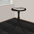 Black Round Top Side Table With Tray Design And Curved Legs In Corner