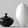 Two Black And White Ceramic Vases Round Short And Oval Tall On Light Gray Background