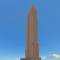 Tall Brown Office Building With Numerous Windows And Blue Sky Background