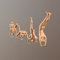 Set Of Golden Human Sculptures In Various Poses From Standing To Handstand