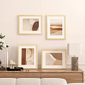 Golden Picture Frames with Abstract Art in Warm Tones for Wall Display with Wooden Furniture