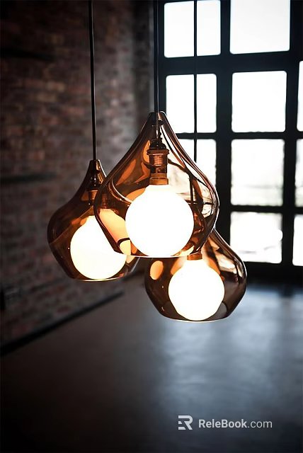 Three Amber Glass Teardrop Pendant Lights Hanging In Bright Interior With Brick Wall 3d model 