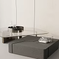 Modern Coffee Table Featuring Glass Top Metal Frame And Decorative Tray With Small Box