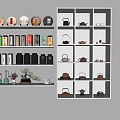 Elegant Tea Ware Collection with Teapots Tea Cakes and Tea Caddies on Illuminated White Shelves