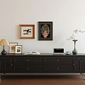 Dark TV Stand With Table Lamp Photo Frames Open Book Vase And Wall Art