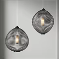 Two Modern Spherical Pendant Lights With Grid Pattern Metal Frame And Warm Glow Hanging In Space