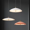 Modern Round Pendant Lights White And Pink With Golden Details Against Dark Wall Background