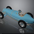 Blue Vintage Race Car With Open Top Streamlined Body And Spoked Wheels