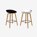 Modern Black And White Bar Stools With Curved Seats And Wooden Legs