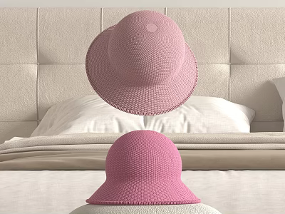 Two Pink Knitted Hats Displayed In Bedroom With Bed Linens 3d model